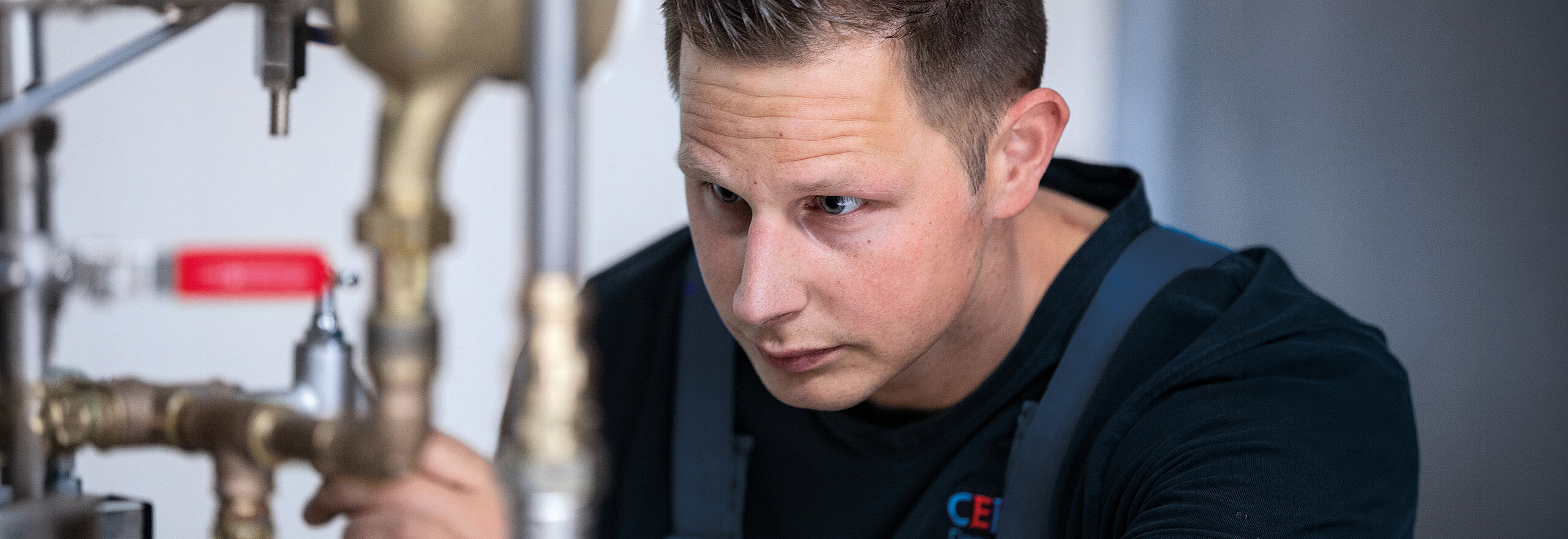 Close-up of a CERTUSS employee working on the steam generator